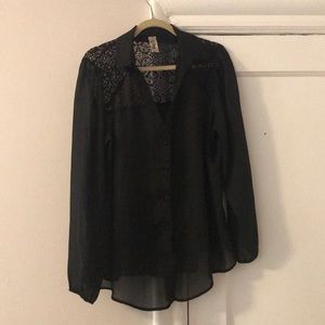 Sheer black blouse with lace design